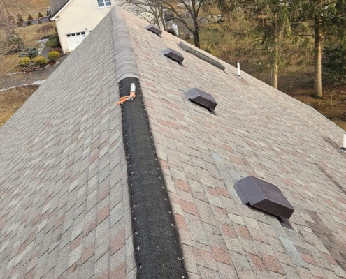 Roofing contractor fixing roof